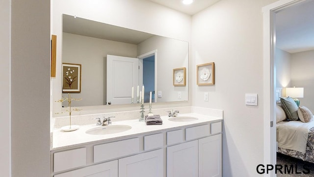 bathroom with large vanity and dual sinks