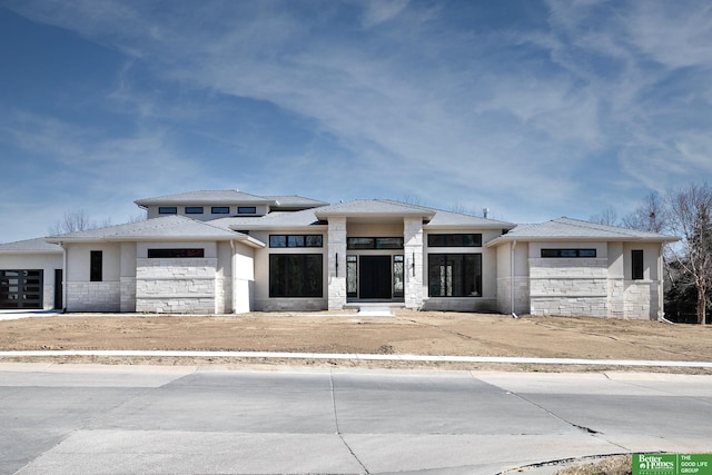 prairie-style house featuring a garage