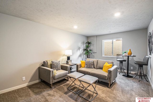 living room featuring dark carpet and a textured ceiling