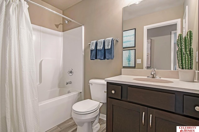 full bathroom featuring hardwood / wood-style flooring, shower / bathtub combination with curtain, vanity, and toilet