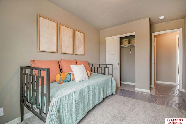 carpeted bedroom with a closet