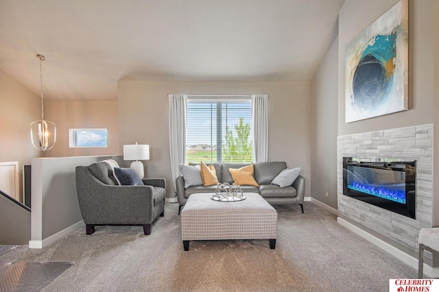 carpeted living room with an inviting chandelier