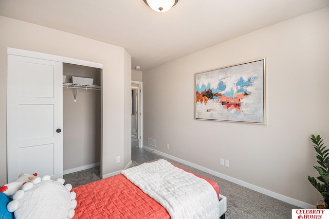 bedroom with dark colored carpet and a closet