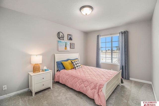 bedroom featuring light carpet