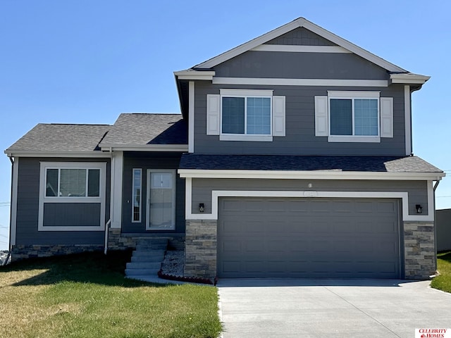 view of front facade with a garage and a front lawn