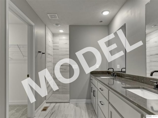 bathroom with dual bowl vanity and tile flooring