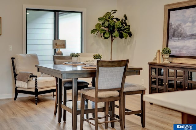 dining room featuring light hardwood / wood-style flooring