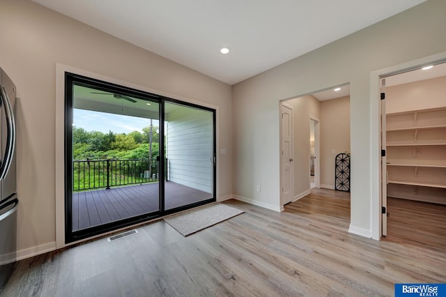 doorway with light hardwood / wood-style flooring