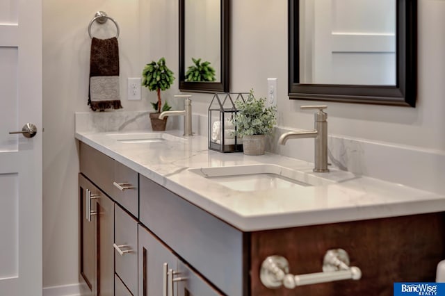 bathroom with oversized vanity and dual sinks