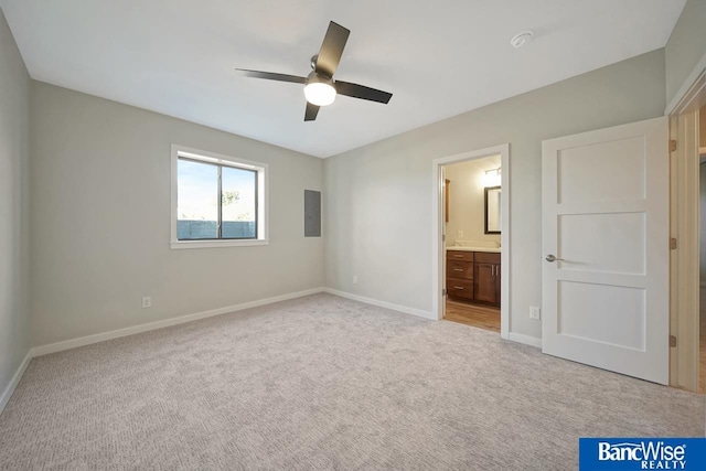 unfurnished bedroom with light colored carpet, ceiling fan, and ensuite bathroom