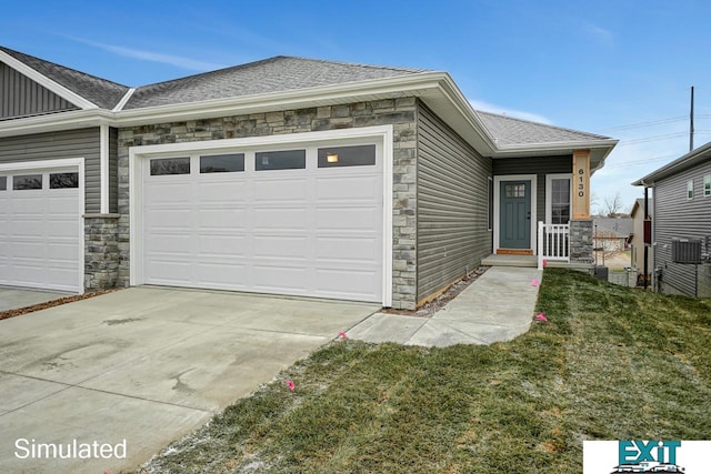 exterior space featuring a lawn and a garage