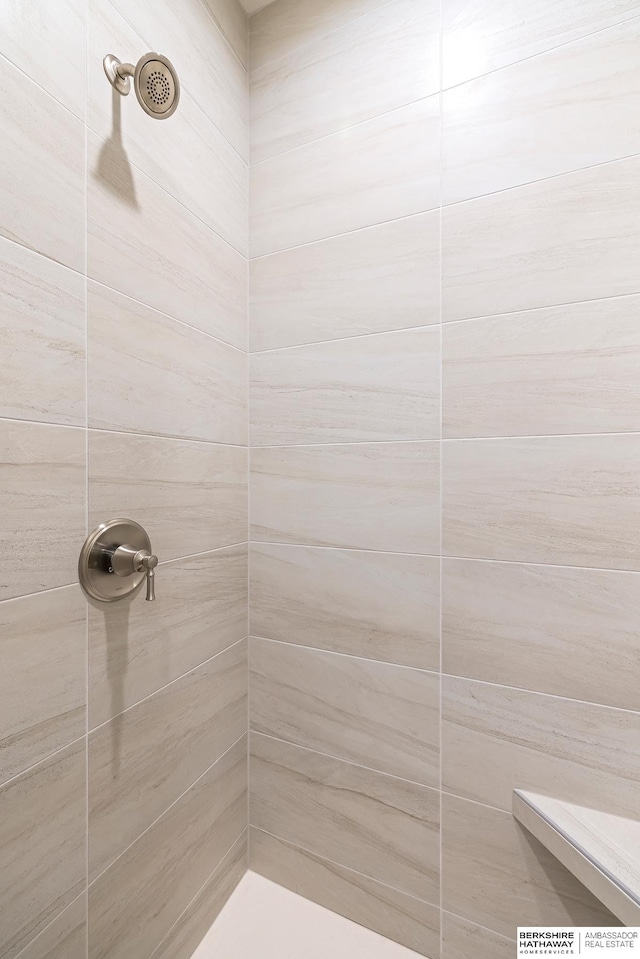 bathroom with a tile shower