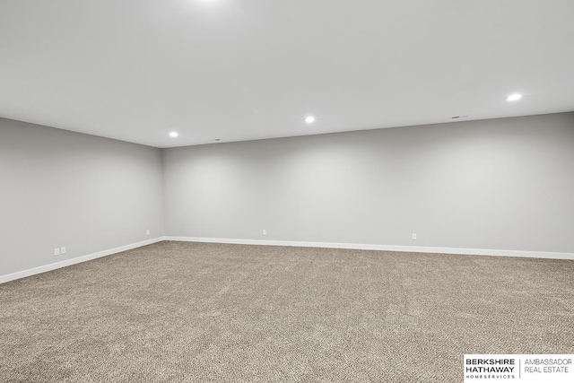 spare room with light colored carpet