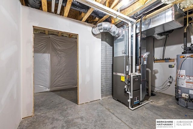 basement featuring gas water heater and heating unit