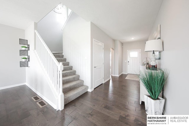 entrance foyer with dark hardwood / wood-style floors