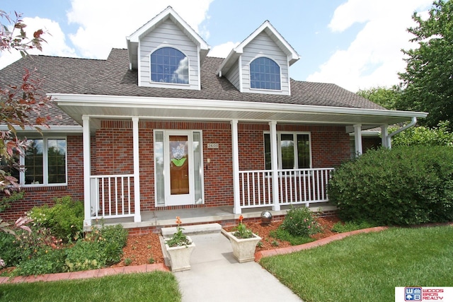 view of front of property featuring covered porch