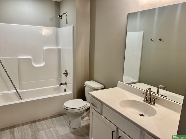 full bathroom featuring toilet, tub / shower combination, and vanity