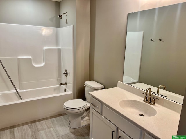 full bathroom featuring vanity, shower / bathtub combination, and toilet