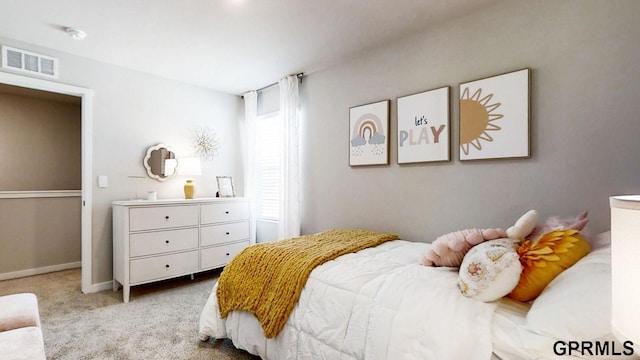 bedroom featuring light colored carpet