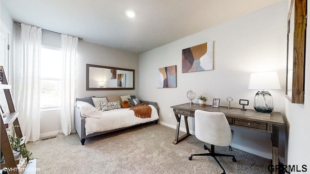 bedroom featuring light carpet