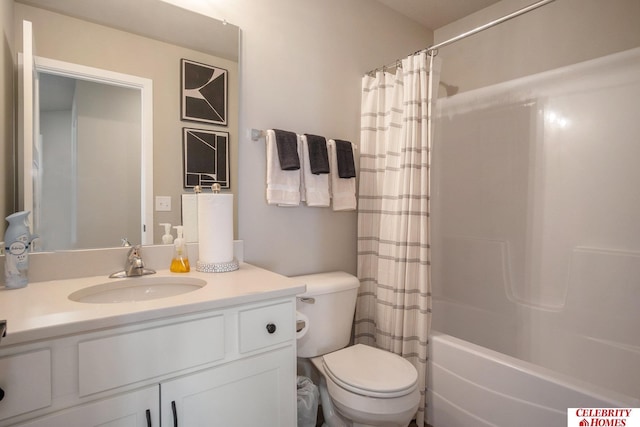 full bathroom with vanity, shower / tub combo, and toilet