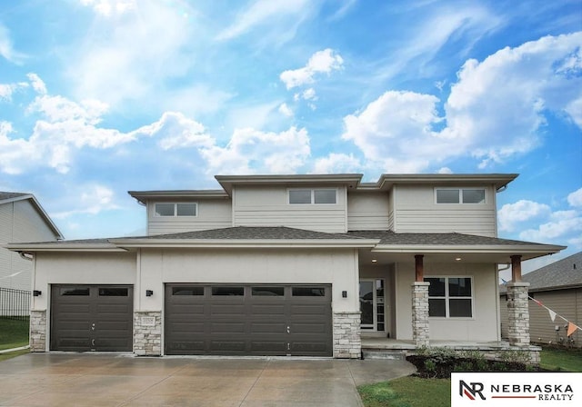 prairie-style house featuring a garage