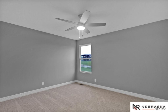 unfurnished room with carpet floors and ceiling fan