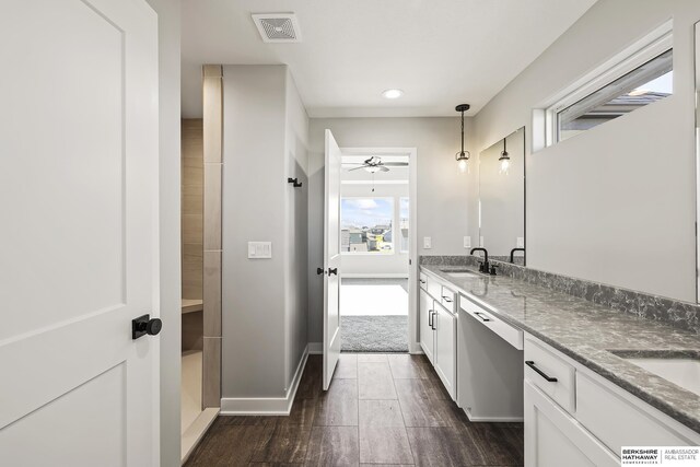 bathroom with ceiling fan and vanity