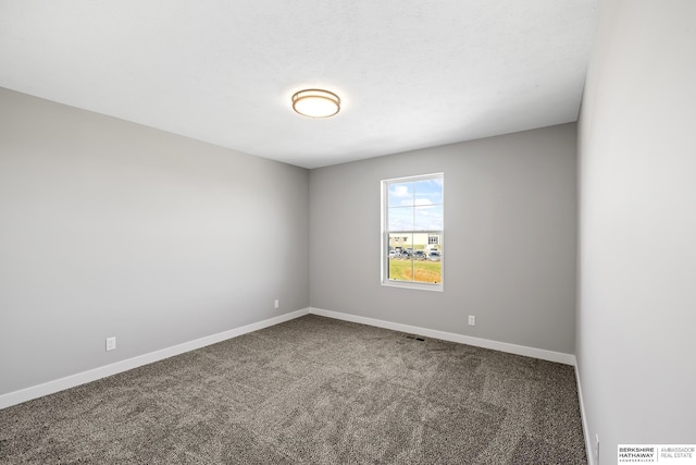 unfurnished room featuring carpet