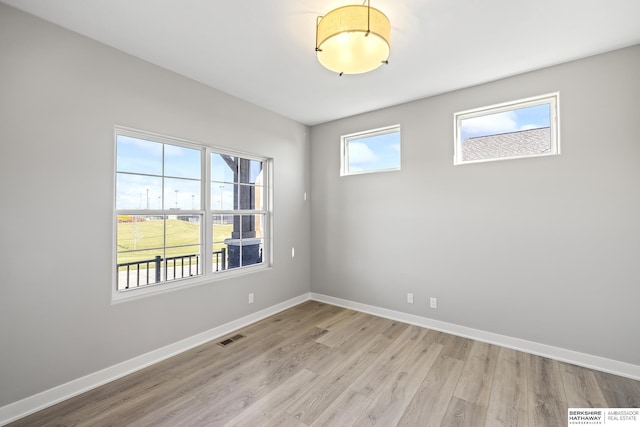 spare room with light hardwood / wood-style floors