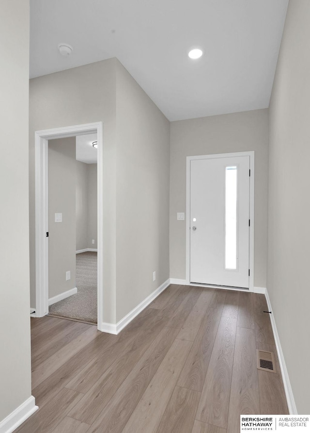 foyer entrance with light hardwood / wood-style flooring