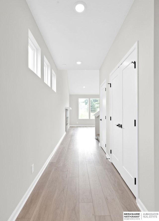 corridor featuring light hardwood / wood-style floors