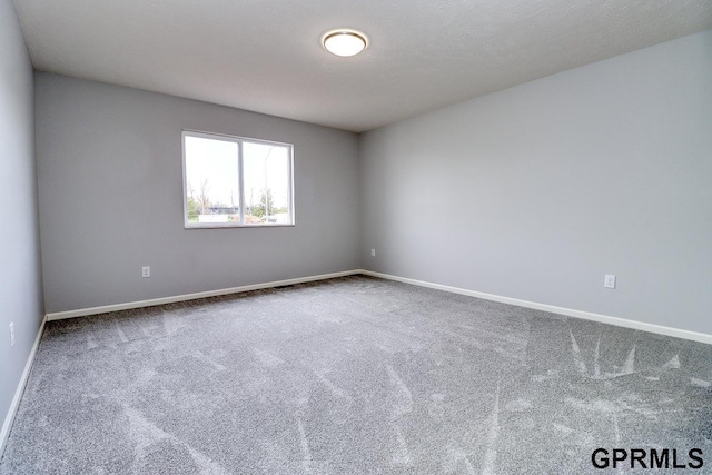 unfurnished room featuring carpet floors