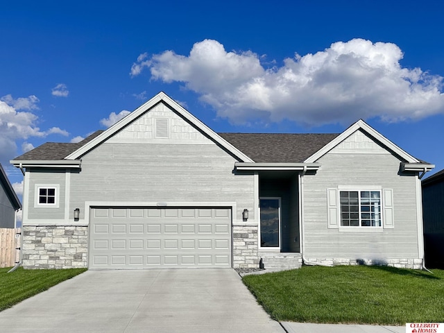 view of front of home featuring a garage and a front lawn