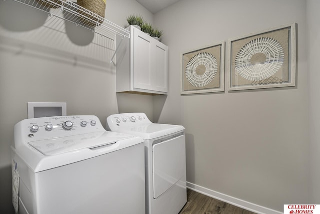 clothes washing area with cabinets, dark hardwood / wood-style floors, and separate washer and dryer