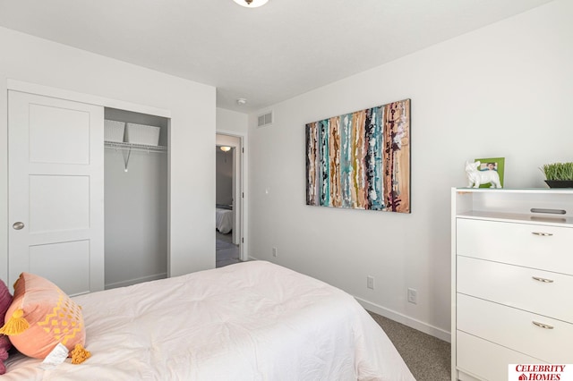 bedroom with dark carpet and a closet