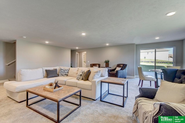 living room with light carpet and a textured ceiling