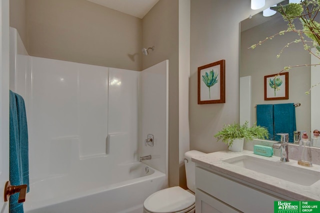 full bathroom featuring shower / tub combination, vanity with extensive cabinet space, and toilet