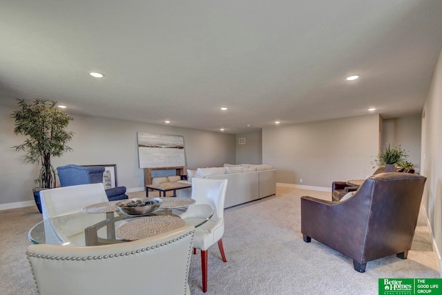 dining space with light colored carpet