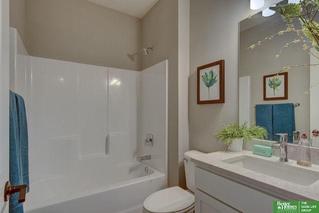 full bath featuring toilet, vanity, and  shower combination