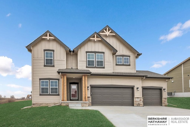 view of front of home with a garage and a front yard