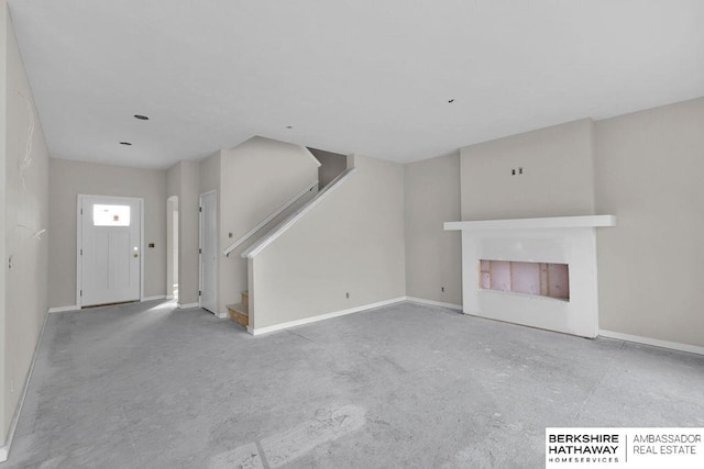 unfurnished living room with a fireplace