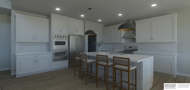 22742 Sanctuary Ridge Dr, Elkhorn, NE 68022 - kitchen with pendant lighting, appliances with stainless steel finishes, white cabinetry, a kitchen island with sink, and light hardwood / wood-style floors
