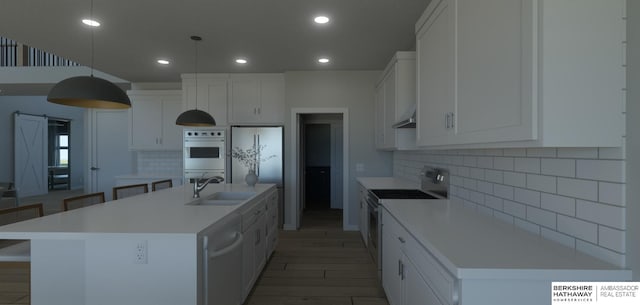22742 Sanctuary Ridge Dr, Elkhorn, NE 68022 - kitchen featuring sink, appliances with stainless steel finishes, pendant lighting, a kitchen island with sink, and white cabinets