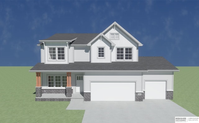 view of front of house with a porch, a garage, and a front lawn