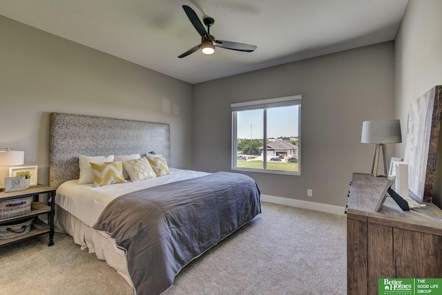 carpeted bedroom with baseboards