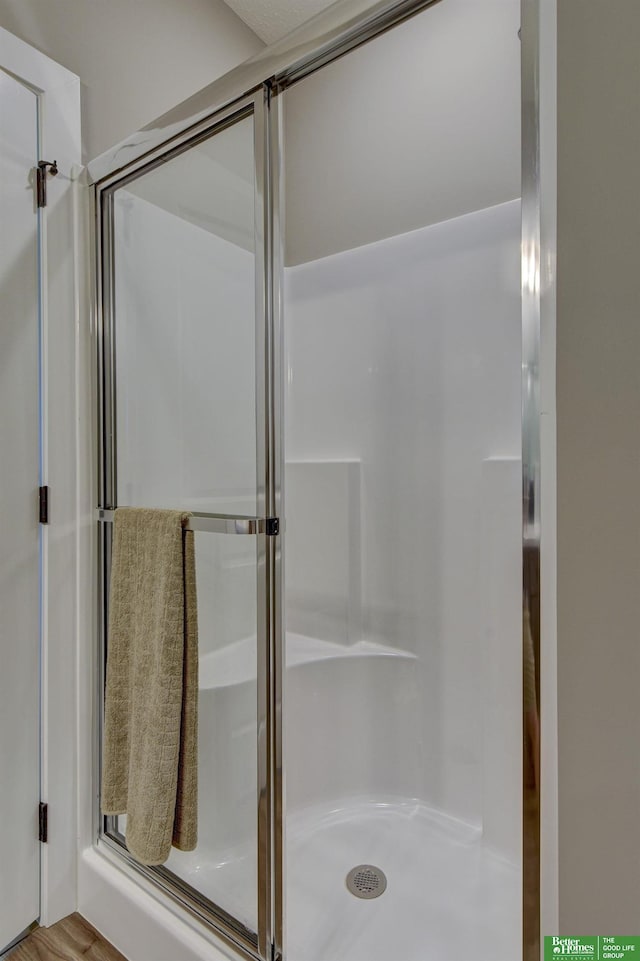 full bathroom with a stall shower