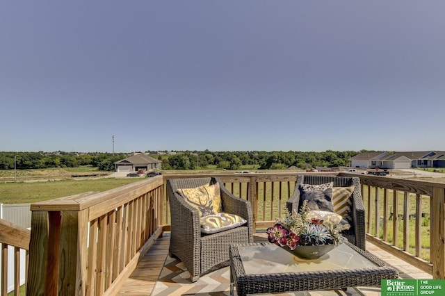 wooden terrace featuring an outbuilding