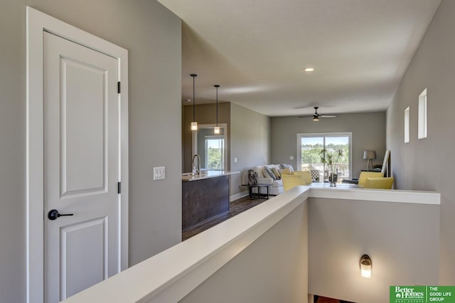 hall featuring a sink