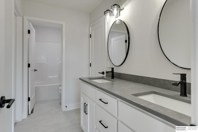 full bathroom with tile patterned flooring, vanity, separate shower and tub, and toilet